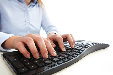 Aufkleber - Hands typing on computer keyboard.