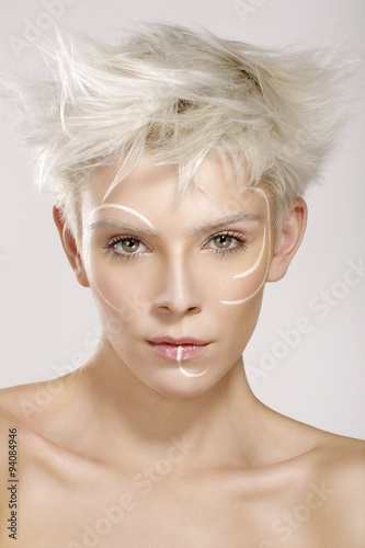 Fototapeta na wymiar beautiful blond model wearing elegant artistic makeup