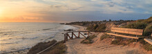 Bench Along An Outlook With A View At Sunset Of Crystal Cove Beach, Newport Beach And Laguna Beach Line In Southern California