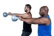 © WavebreakmediaMicro - Strong friends lifting kettlebells together