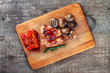grilled meat and vegetables on the cutting board