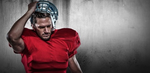 Poster - Composite image of american football player in removing helmet