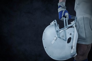 Poster - Close-up of american football player holding helmet