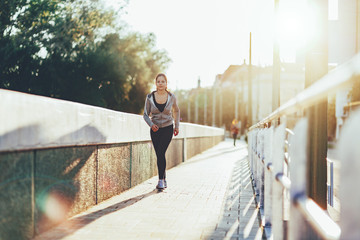 Beautiful female jogging in city