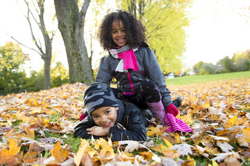 Wall Mural - Childs on the leaf season. The autumn season