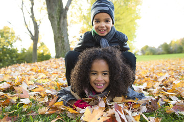 Wall Mural - Childs on the leaf season. The autumn season