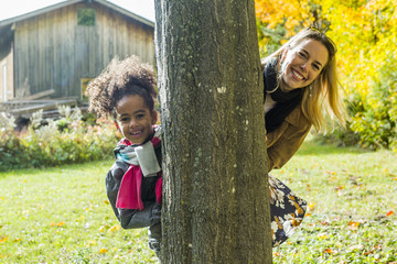 Wall Mural - Happy family having fun on beautiful autumn day