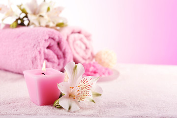 Poster - Spa treatment and flowers on wooden table, on light background