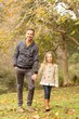 © WavebreakmediaMicro - Happy father and daughter walking together in park