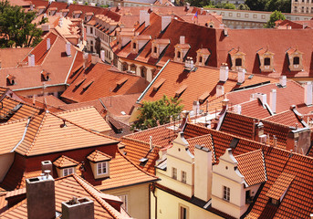 Houses with traditional red roofs in Prague Old Town Square in t