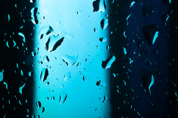 Water droplets on colored glass. Abstract background texture. Ve