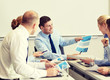 © Syda Productions - business people with papers meeting in office