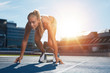 © Jacob Lund - Professional female track athlete on sprinting blocks