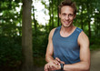 © Flamingo Images - Muscular athlete setting his stopwatch