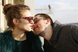 Fototapeta Paryż - Boy wants to kiss a girl with red lipstick