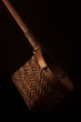 Bamboo Tea Strainer - A close up of a bamboo tea strainer against a dark background