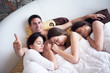 © .shock - handsome man in bed with three beautiful woman