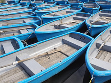 Group Of Blue Rowboat At River