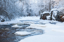 River With Snow And Ice In The Winter Woods