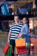 © .shock - young couple with shipping bags