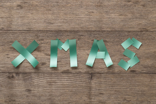 Xmas - Ribbon 'Xmas' on wooden background