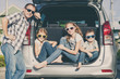 © altanaka - Happy family getting ready for road trip on a sunny day