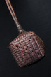 Bamboo Tea Strainer - A close up of a bamboo tea strainer against a grey background