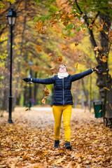 Wall Mural - middle-age woman walking in city park