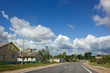 © scadidi - White clouds and blue sky over the road