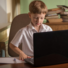 boy with laptop at table