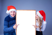 Christmas Couple Holding White Board With Empty Copy Space 