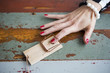 closeup of woman's finger in mousetrap