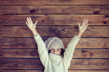 Sticker - Child posing in knitted clothing