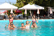 © Africa Studio - Young people having fun in the swimming pool