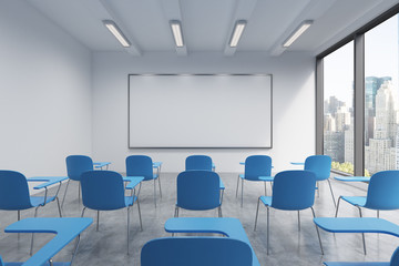 a classroom or presentation room in a modern university or fancy office. blue chairs, a whiteboard o