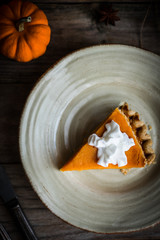 Wall Mural - Pumpkin pie on rustic wooden background