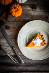 Wall Mural - Pumpkin pie on rustic wooden background