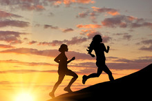  Silhouette Of Two Girls Running Competition