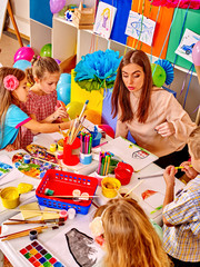 Wall Mural - Children with teacher in  kindergarten .