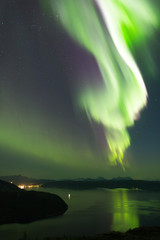 aurora across norwegian fjord