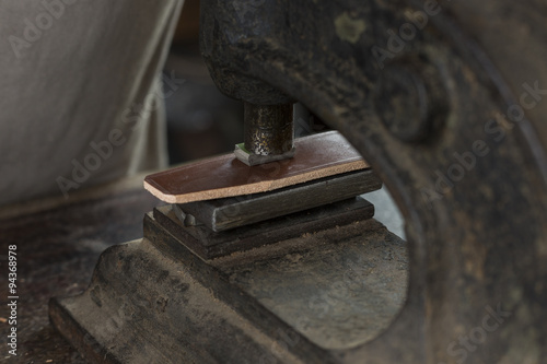 Fotografie, Obraz Process of making a leather belt with a low depth of field, embossing