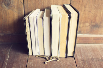 Poster - Old books with old style keys on the wooden floor