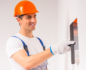 Wall Mural - Male repairs indoors