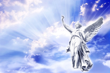 Wall Mural - angel in the sky with divine rays of light