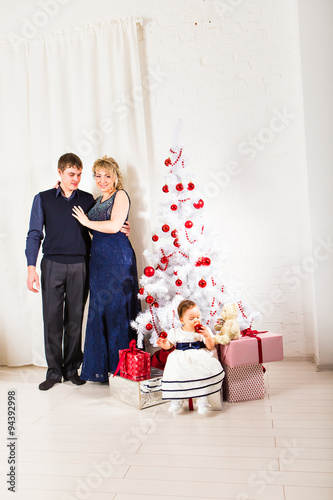 Christmas Family Portrait In Home Holiday Living Room Kid With Present Gift Box House With Xmas Tree Buy This Stock Photo And Explore Similar Images At Adobe Stock Adobe Stock