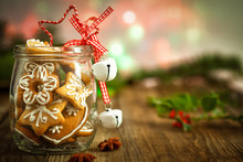 Christmas Cookies In A Jar  On Wooden Background With Christmas Holly