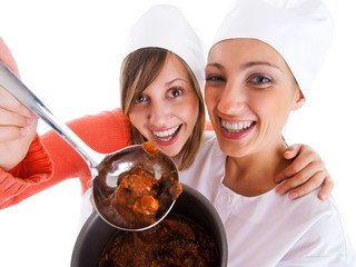 Canvas Print - Young women cooking