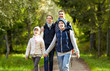 © Syda Productions - happy family with backpacks hiking