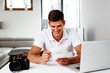 © baranq - Great memories. Young photographer editing his images