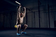 © baranq - Squat with kettlebells over head